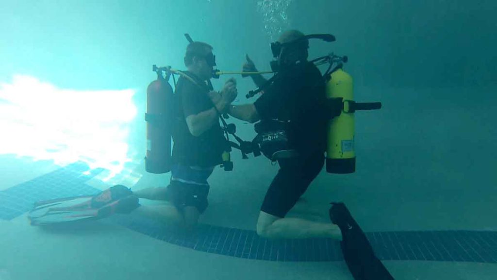 Photo of students and teacher in swimming pool with Ennis Cuba Diving in Ennis Texas