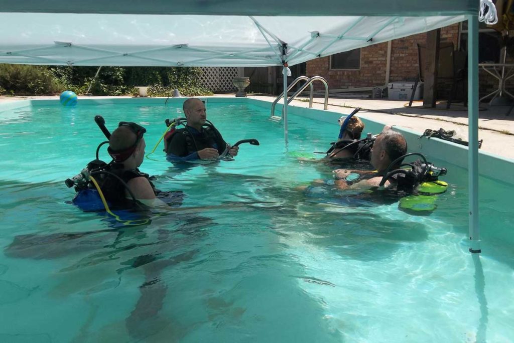Photo of students and teacher in swimming pool with Ennis Cuba Diving in Ennis Texas